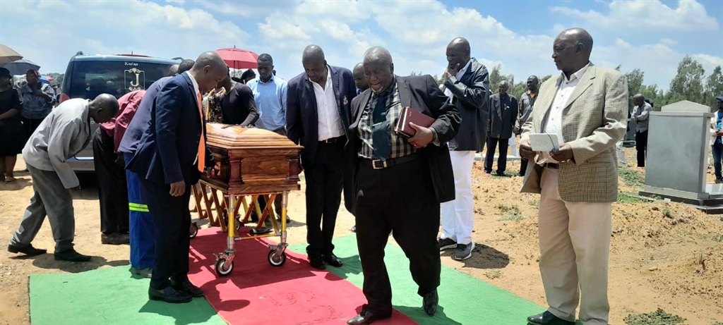 Pallbearers carrying the coffin of Ntando Tsotetsi to its final resting place. Photo by Tumelo Mofokeng.