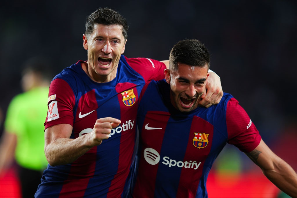 BARCELONA, SPAIN - NOVEMBER 12: Robert Lewandowski of FC Barcelona celebrates with Ferran Torres of FC Barcelonaafter scoring the teams second goal during the LaLiga EA Sports match between FC Barcelona and Deportivo Alaves at Estadi Olimpic Lluis Companys on November 12, 2023 in Barcelona, Spain. (Photo by Eric Alonso/Getty Images)
