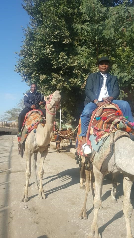 Bafana Bafana team manager Levy Ramajoe and Coach Molefi Ntseki camel riding in Cairo. 