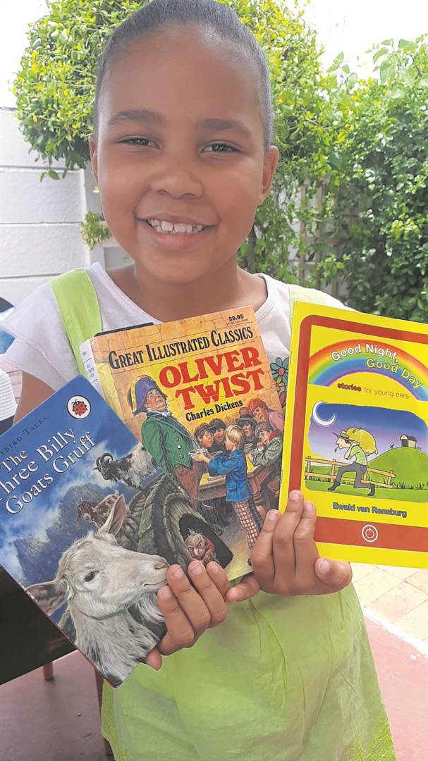 Cassidy Hendricks (8) from Lotus River enjoys reading at old-age homes and schools in her neighbourhood.PHOTO: Supplied 