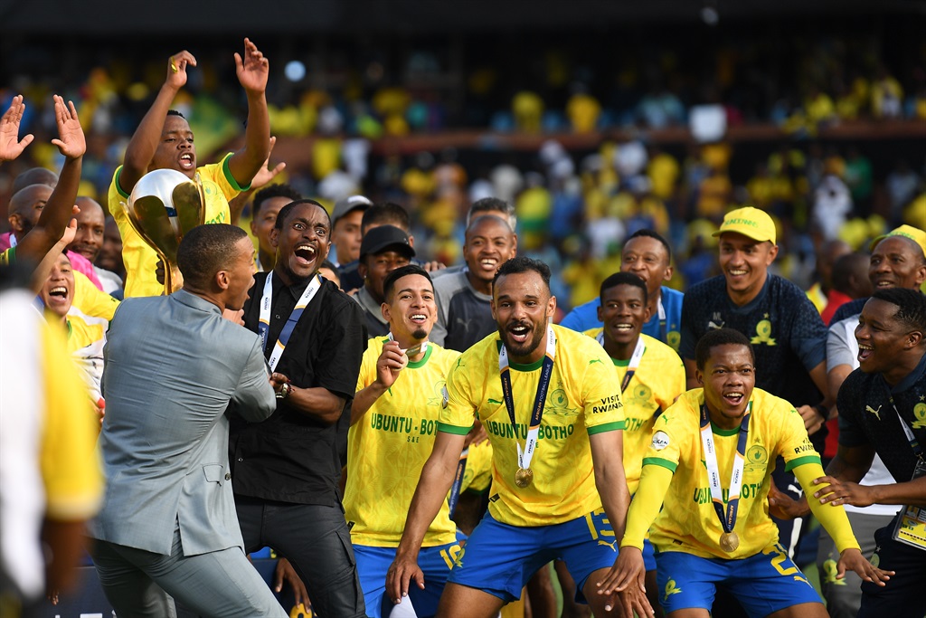 Tlhopie Motsepe and Mamelodi Sundowns head coach Rulani Mokwena celebrates with Mamelodi Sundowns' players during the African Football League Final - 2nd Leg match against Wydad AC at Loftus Versfeld in Pretoria,