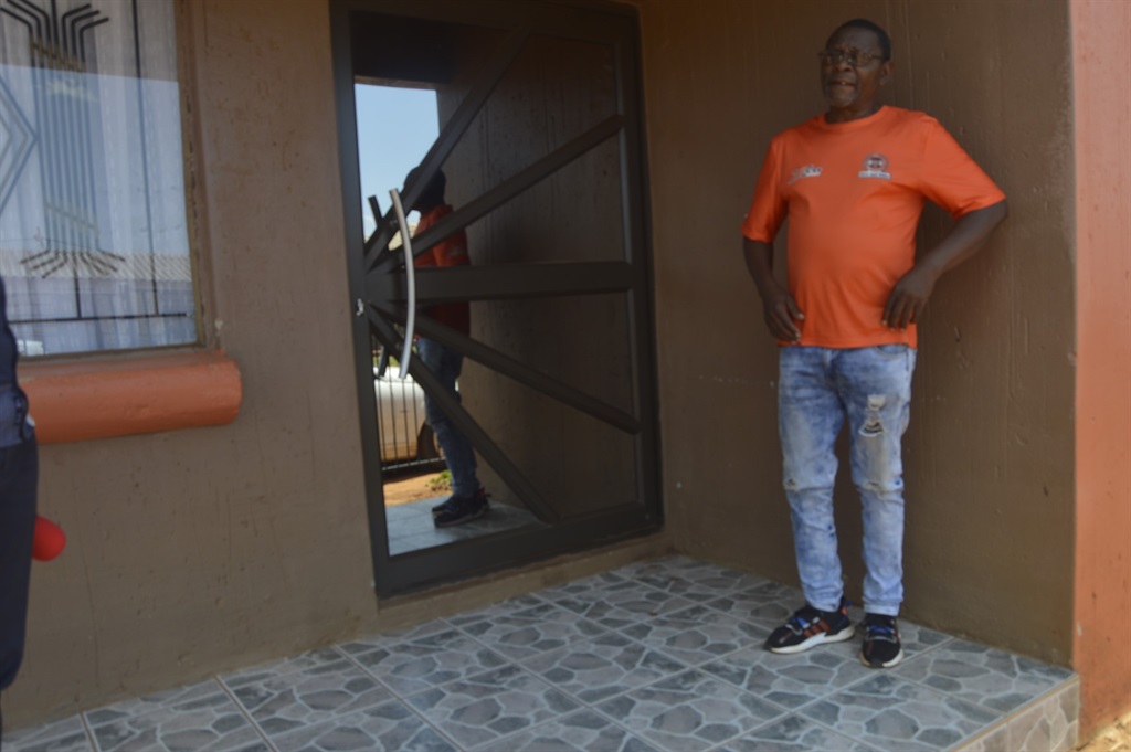 Phalli standing at the doorstep where Tumelo Mofok