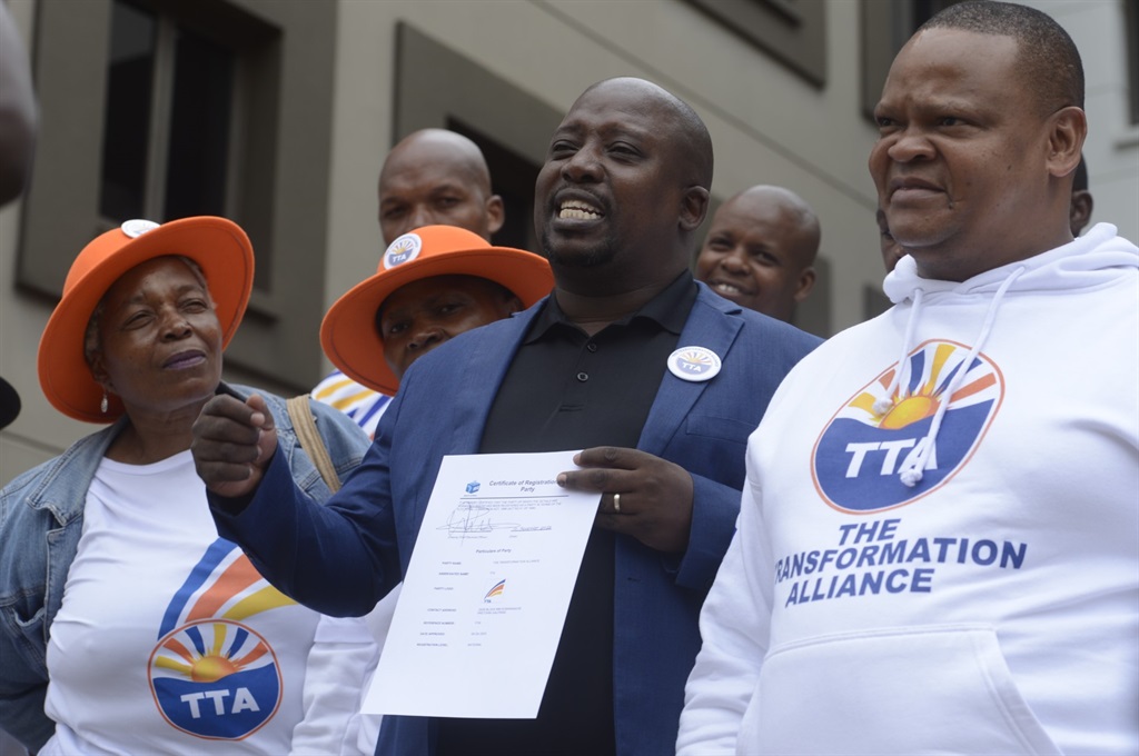 The Transformation Alliance (TTA) president Abel Tau (centre) outside the IEC head office in Tshwane. Photo by Raymond Morare