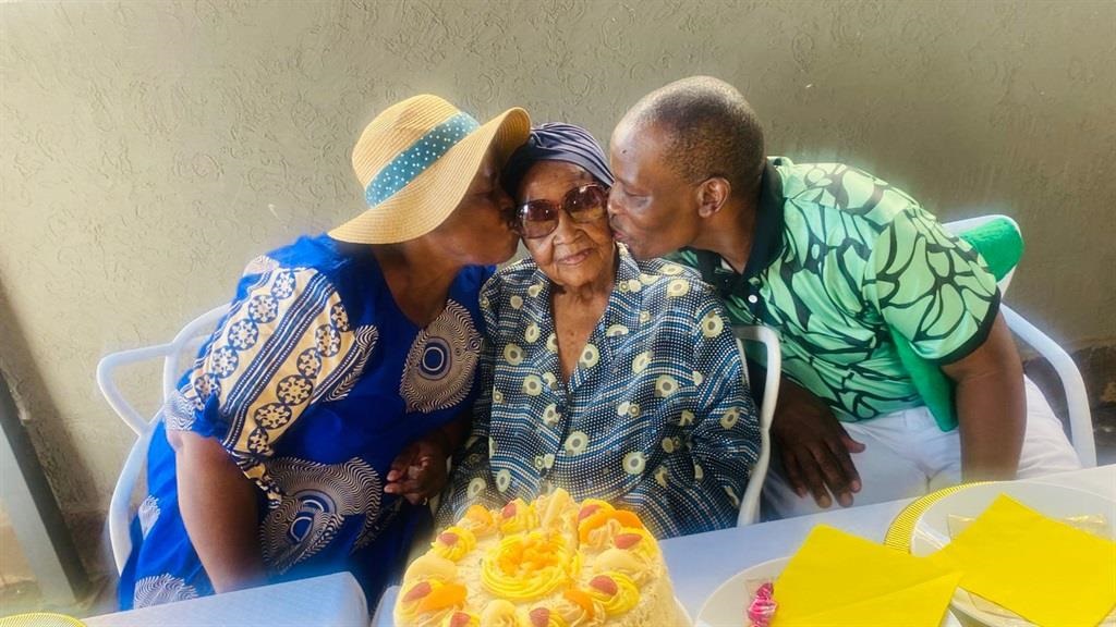 From left: Francinah Mokgokong (64), koko Ester Mabitsela (112) and Peter Mabitsela (54) during the birthday party. Photo by Keletso Mkhwanazi
