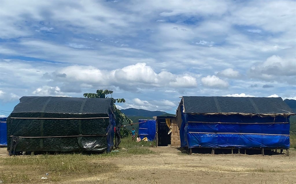 Basic shelters for refugees are pictured at a quarantine camp in India in September 2021, after people from Myanmar fled across the Chin border to escape a military attack. (Photo by AFP)