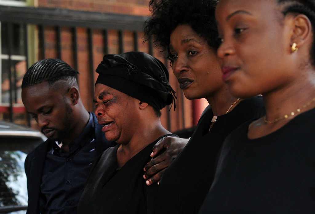 Enock Mpianzi's family during a memorial service a