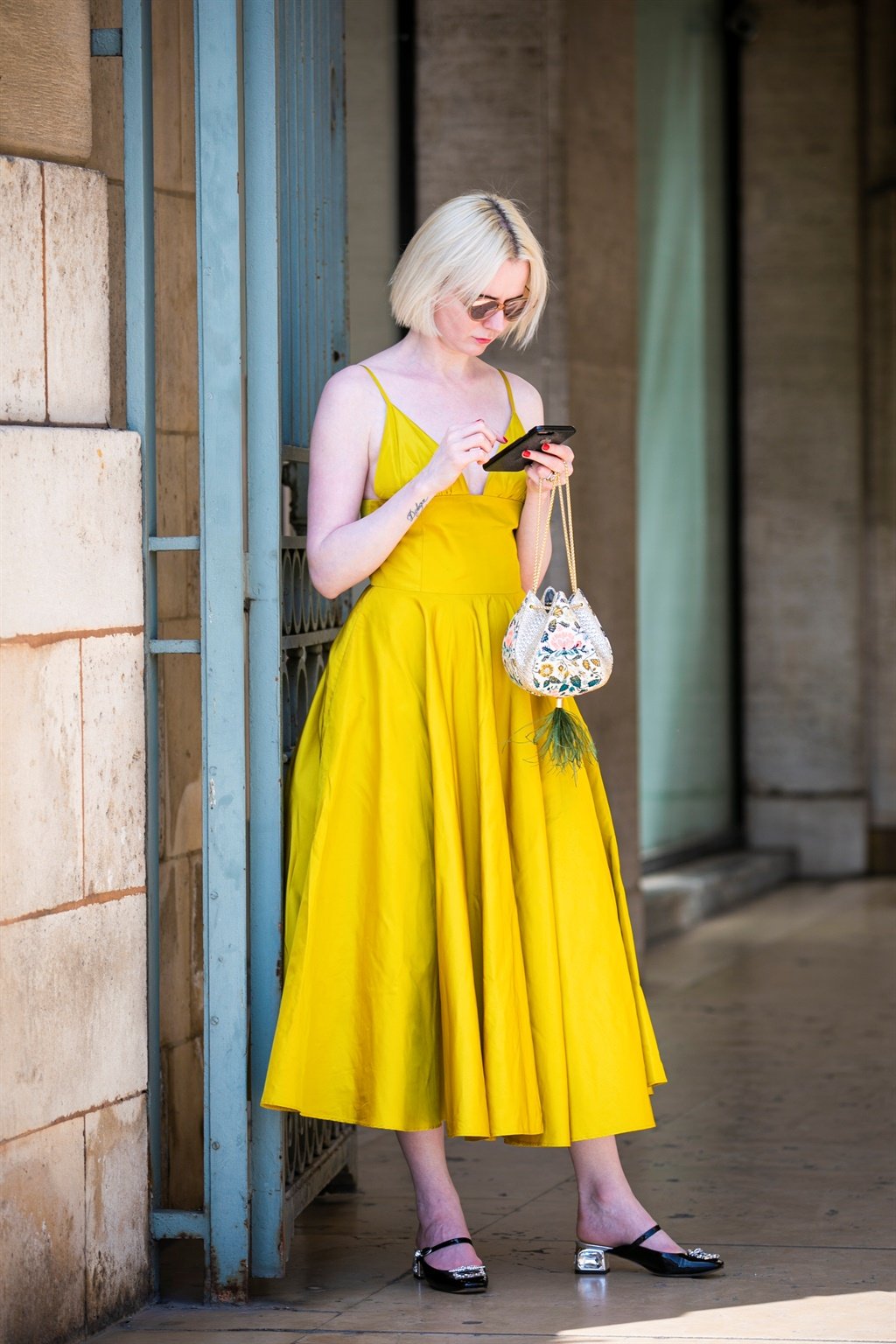 PARIS, FRANCE - JULY 01: A guest, wearing a yellow
