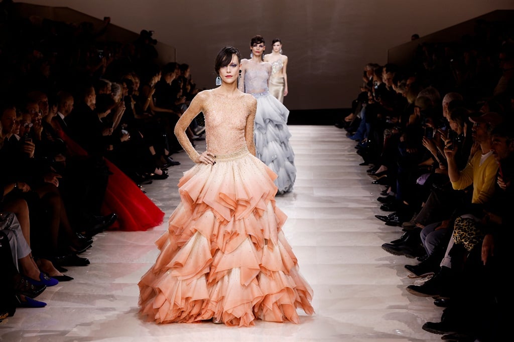 A model presents a creation by designer Giorgio Armani as part of his Haute Couture Spring-Summer 2024 collection show for Giorgio Armani Prive in Paris, France, 23 January 2024. 