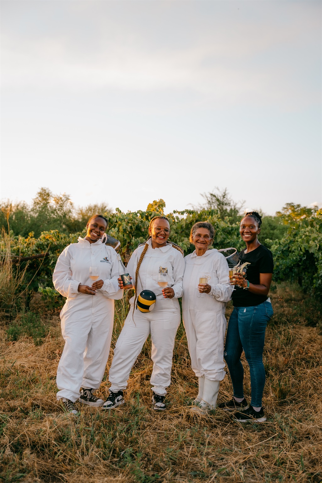 The Moedi Wines Team in the beekeeper uniforms.