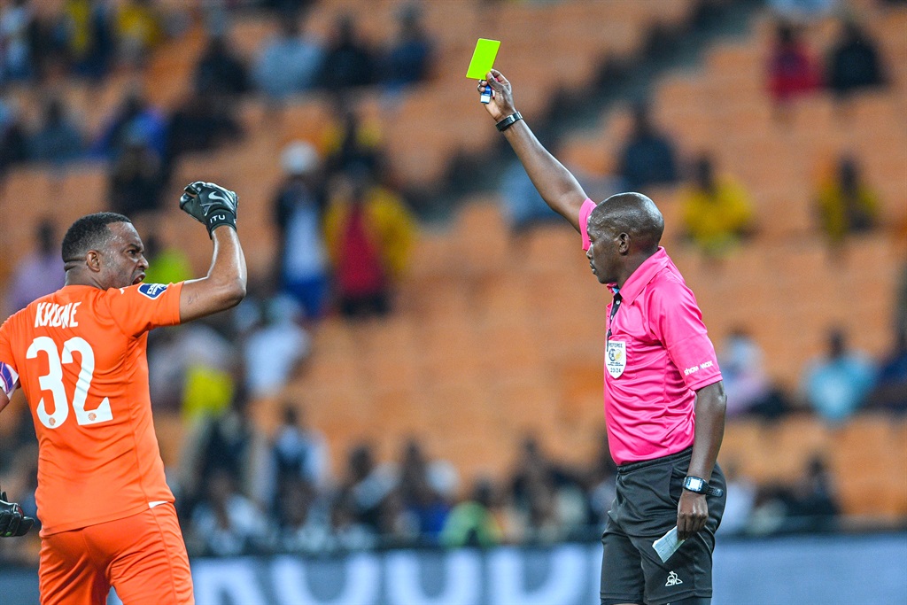 JOHANNESBURG, SOUTH AFRICA - OCTOBER 03: Referee Skhumbuzo Gasa gives Itumeleng Khune a yellow card during the DStv Premiership match between Kaizer Chiefs and Cape Town City FC at FNB Stadium on October 03, 2023 in Johannesburg, South Africa. (Photo by Lefty Shivambu/Gallo Images)
