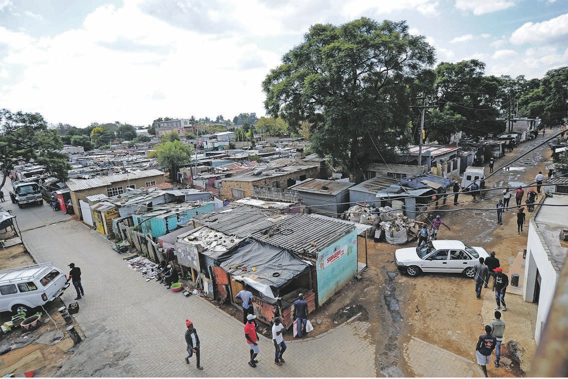 Residents of Zandspruit in Johannesburg say they can’t conform to the lockdown rule to stay indoors because their shacks are small and each home has about five people in it. Pictures: Rosetta Msimango