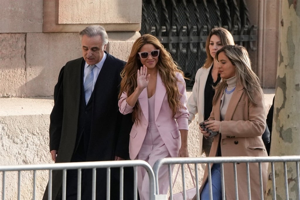 Colombian singer Shakira arrives with her lawyer Pau Molins (L) at the High Court of Justice of Catalonia in Barcelona on 20 November 2023.