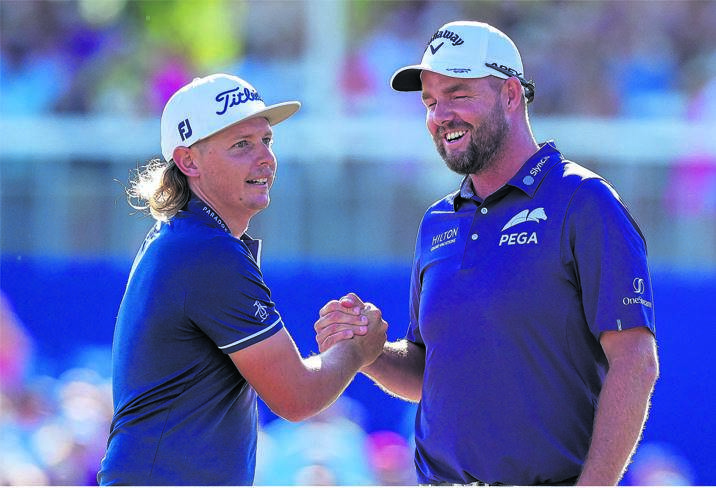Cameron Smith shakes hands with Marc Leishman after winning the final round round of the Zurich Classic of New Orleans golf tournament in Avondale, Louisiana, on Sunday.