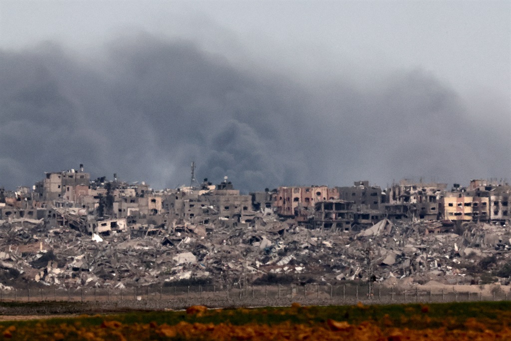 A picture taken from southern Israel near the border with the Gaza Strip on 21 December 2023, shows smoke billowing following Israeli bombardment in the Palestinian territory amid ongoing battles with the Palestinian Hamas militant group.