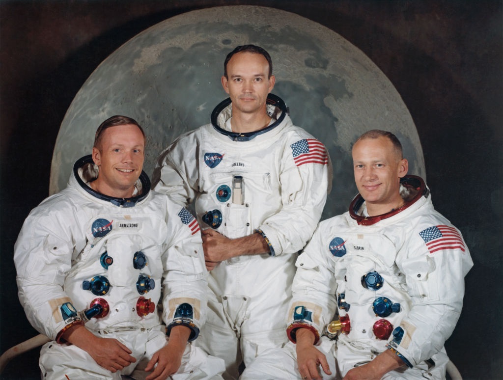 The three crew members of NASAs Apollo 11 lunar landing mission pose for a group portrait a few weeks before the launch. From left to right, Commander Neil Armstrong, Command Module Pilot Michael Collins and Lunar Module Pilot Edwin Buzz Aldrin.