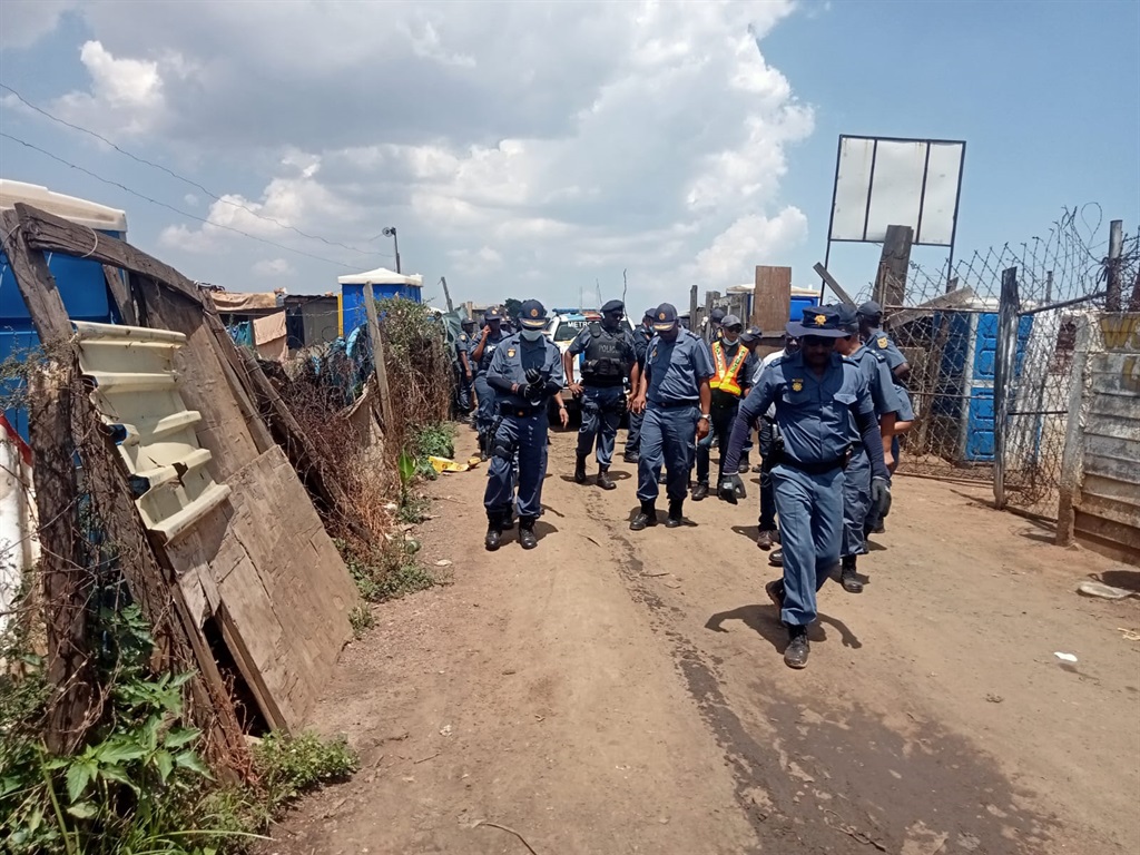 Police at the Angelo squatter camp.