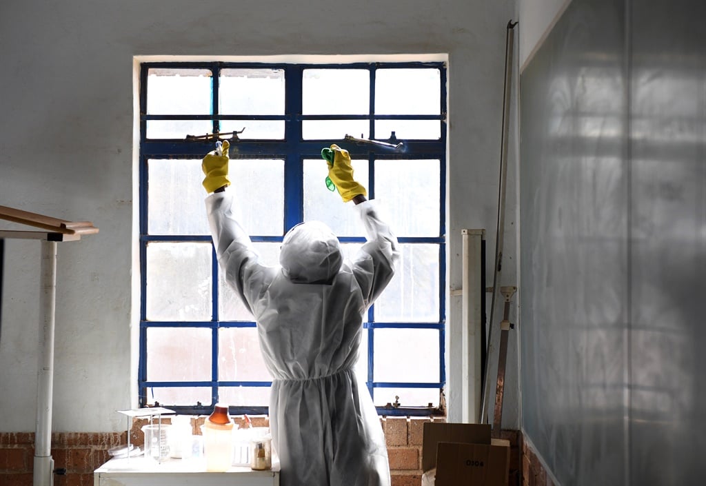 Disinfecting and cleaning of a school classroom.