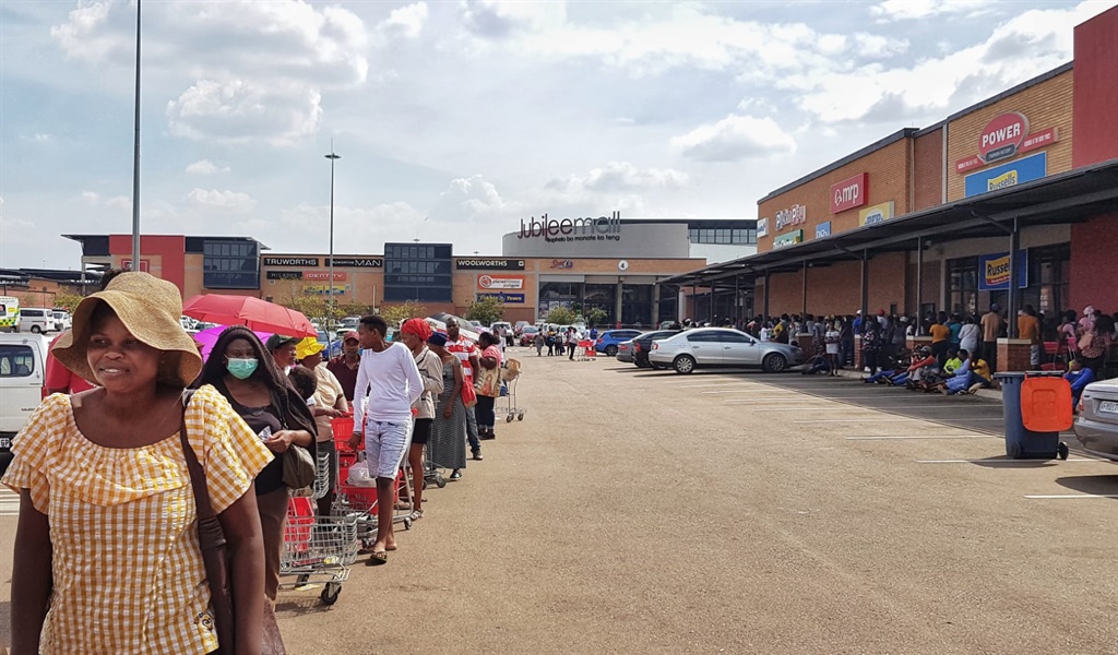 People queuing to get into a mall so that they can access their social grants. (Tebogo Letsie, City Press)