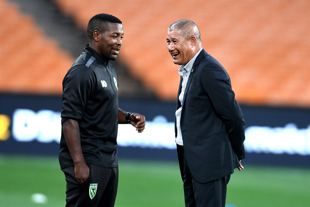 Golden Arrows coach Mabhudi Khenyeza and Kaizer Chiefs coach Cavin Johnson during the DStv Premiership match between Kaizer Chiefs and Golden Arrows at FNB Stadium on March 05, 2024 in Johannesburg, South Africa. 