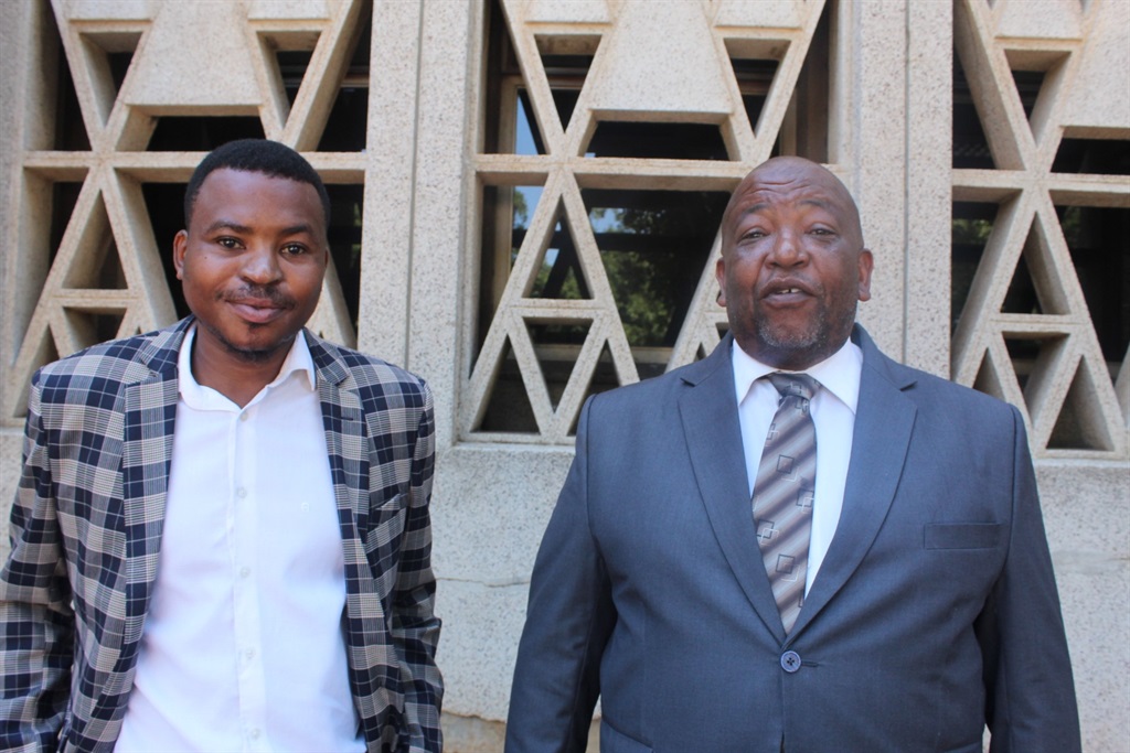 Sibusiso Kula with his attorney Gcina Dlanjwa outside the Klerksdorp Magistrates Court. Photo by Boitumelo Tshehle