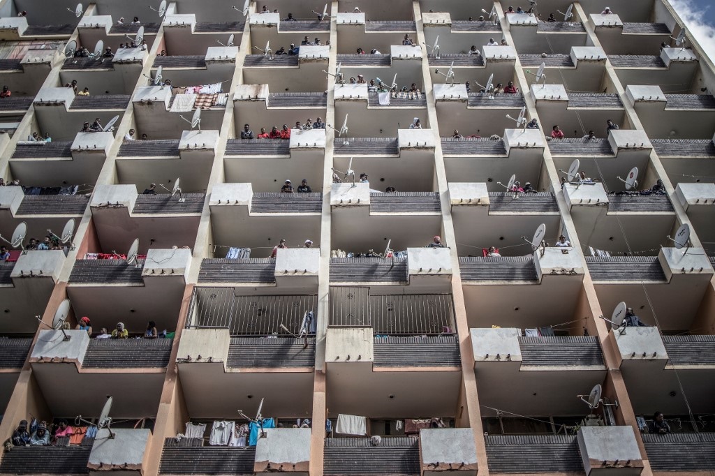Residents of a Hillbrow building observe from the 