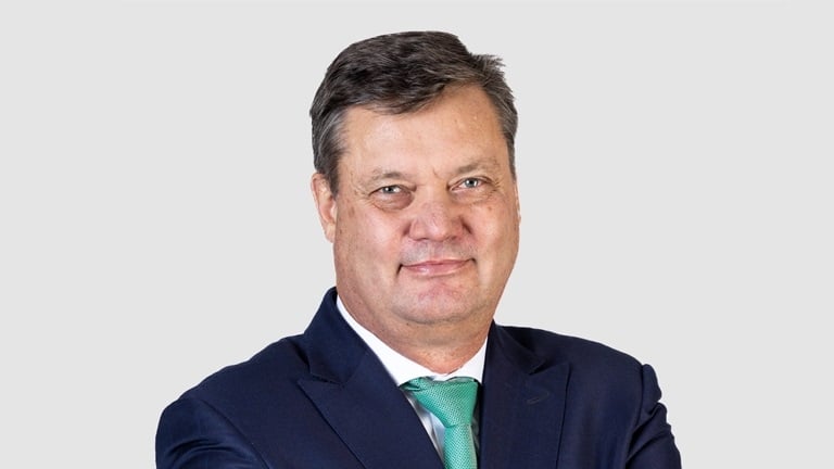 Old Mutual CFO Casper Troskie will be staying on an extra year to help with accounting standard changes and building a new bank.