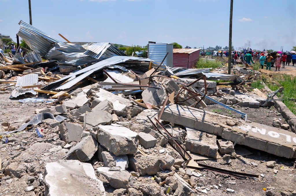shacks, homes, demolished
