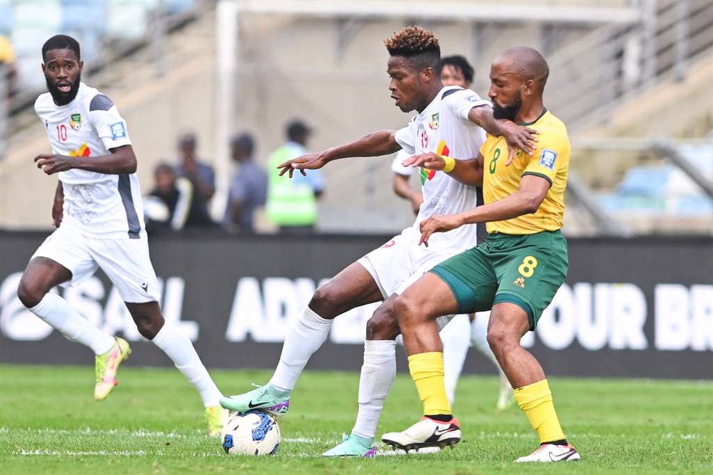 DURBAN, SOUTH AFRICA - NOVEMBER 18: Dokou Dodo of Benin and Sibongiseni Mthethwa of South Africa during the 2026 FIFA World Cup, Qualifier match between South Africa and Benin at Moses Mabhida Stadium on November 18, 2023 in Durban, South Africa. (Photo by Darren Stewart/Gallo Images)