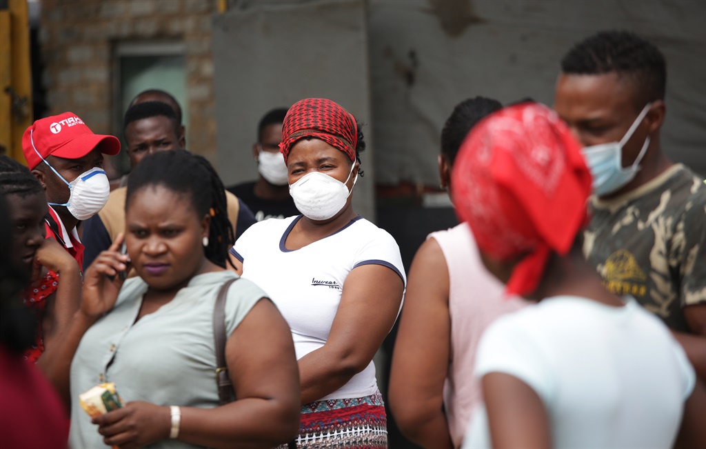 Residents of Stjwetla Section in Alexandra township queue for Covid-19 swab tests outside a testing station on March 31, 2020.