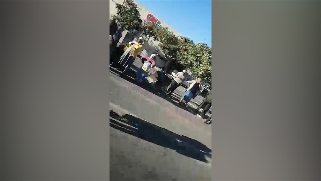 Khayelitsha residents queueing outside Makhaza Shopping Centre during lockdown.