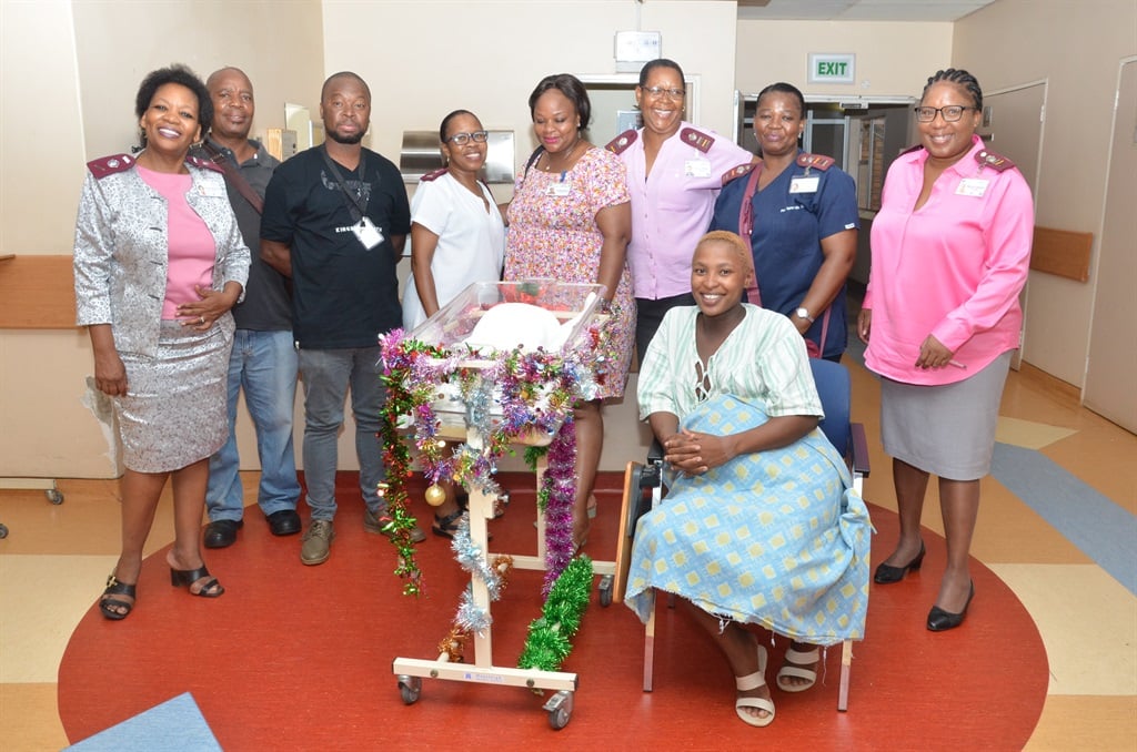 The nurses at Moses Kotane Hospital celebrate the little girl who was born on Christmas Day, together with her mother Puleng Lephoto. Photo by Rapula Mancai