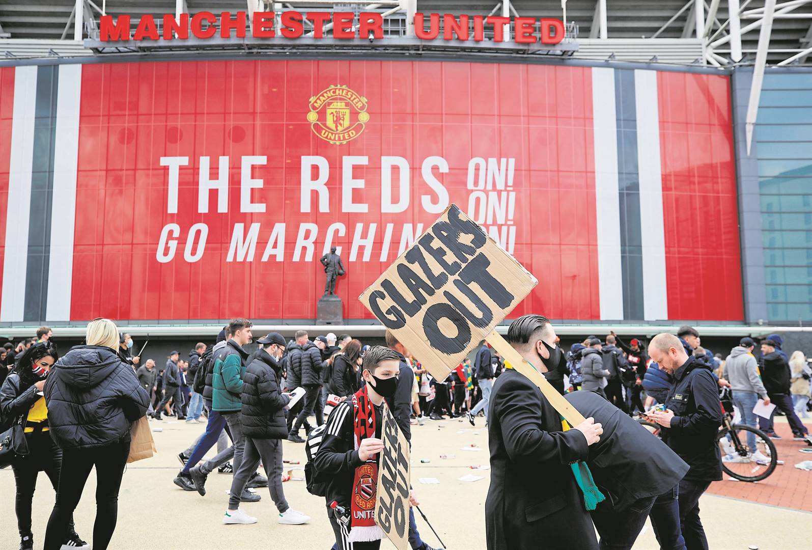 Manchester United fans protest against their owners before the Manchester United versus Liverpool Premier League match on Sunday. PHOTO: reuters