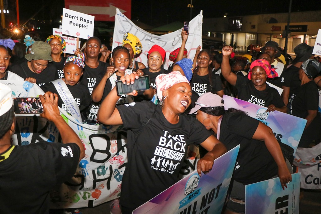 Women engaged in a Bring Back the Night Walk campa
