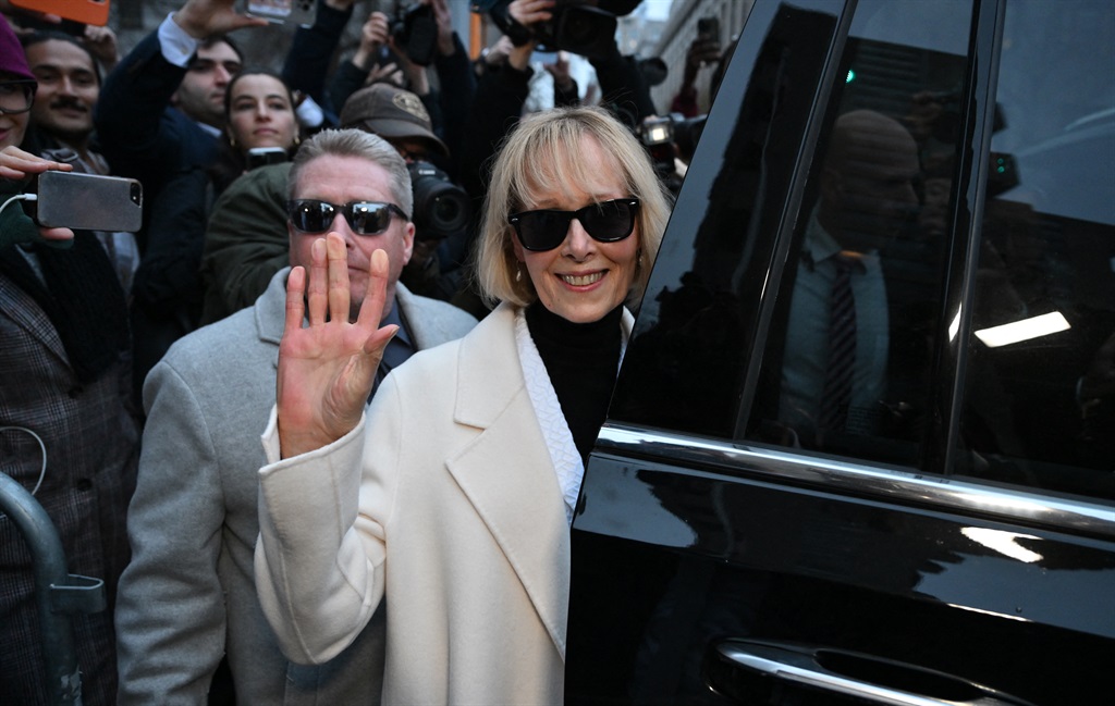 Writer E. Jean Carroll waves as she leaves federal