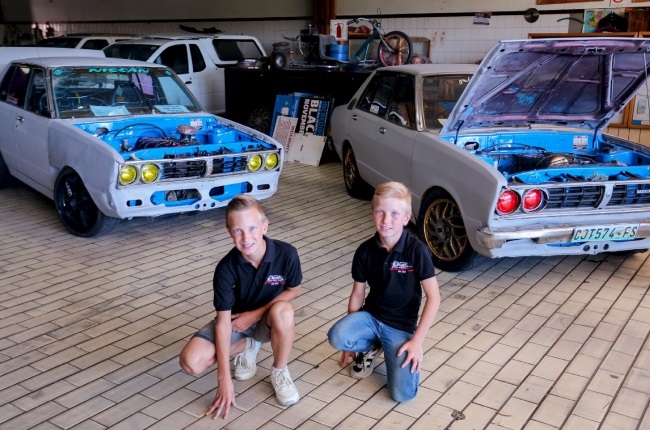 Brothers Benjamin (left) and Christopher de Necker each have their own 1976 Datsun Stanza 1800 to tinker with. (PHOTO: Fani Mahuntsi)