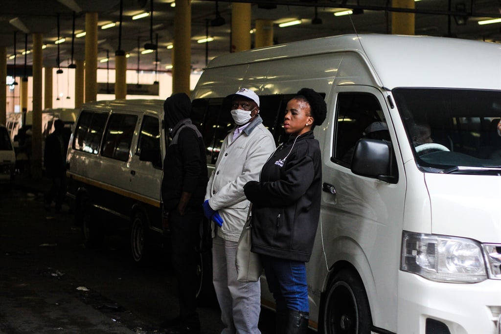 Commuters are seen waiting in line for a taxi at Noord Taxi Rank. Picture: Rosetta Msimango/City Press