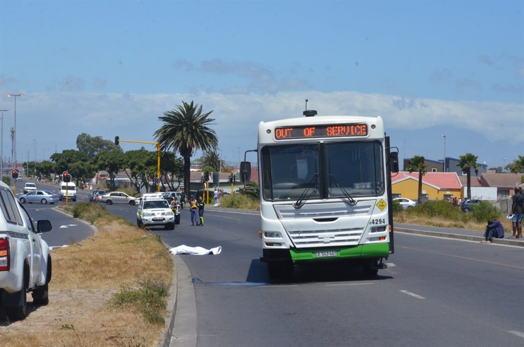Police and forensics at the scene where a bus killed a pedestrian. Photo by Lulekwa Mbadamane