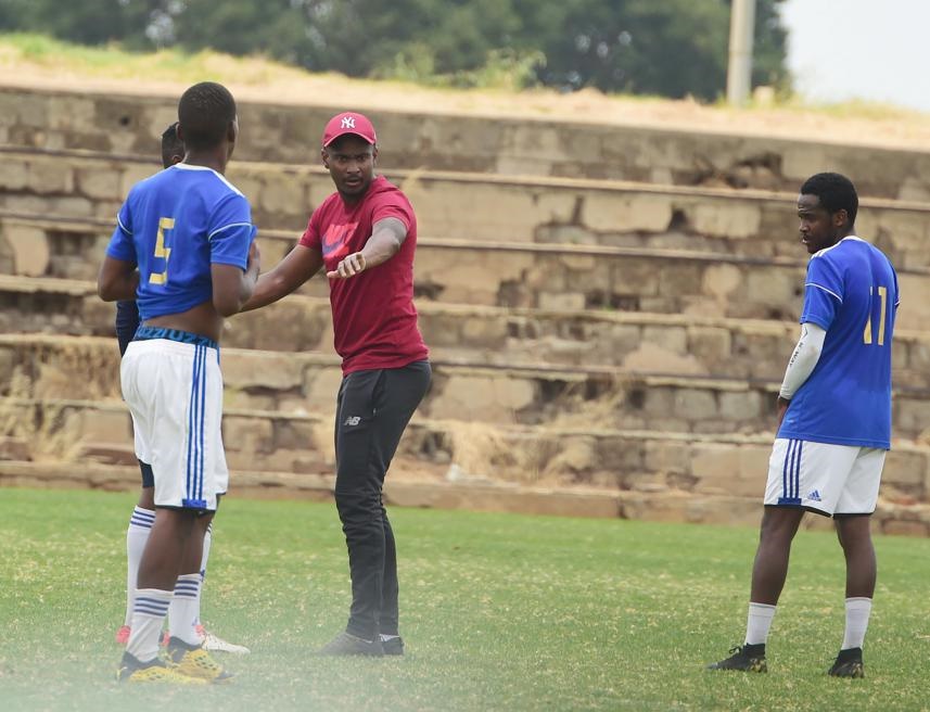 Rhulani Mokwena working with youngsters at his amateur club Black Poison FC. Photo by Trevor Kunene