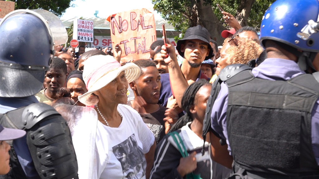 Angry residents protest outside the Goodwood Magistrate's Court on Friday where Tazne van Wyk's alleged murderer Moyhdine Pangarker appeared. 