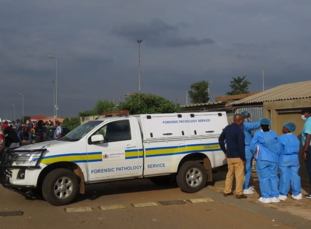 Forensic officials and cops at the scene. Photo by Zamokuhle Mdluli