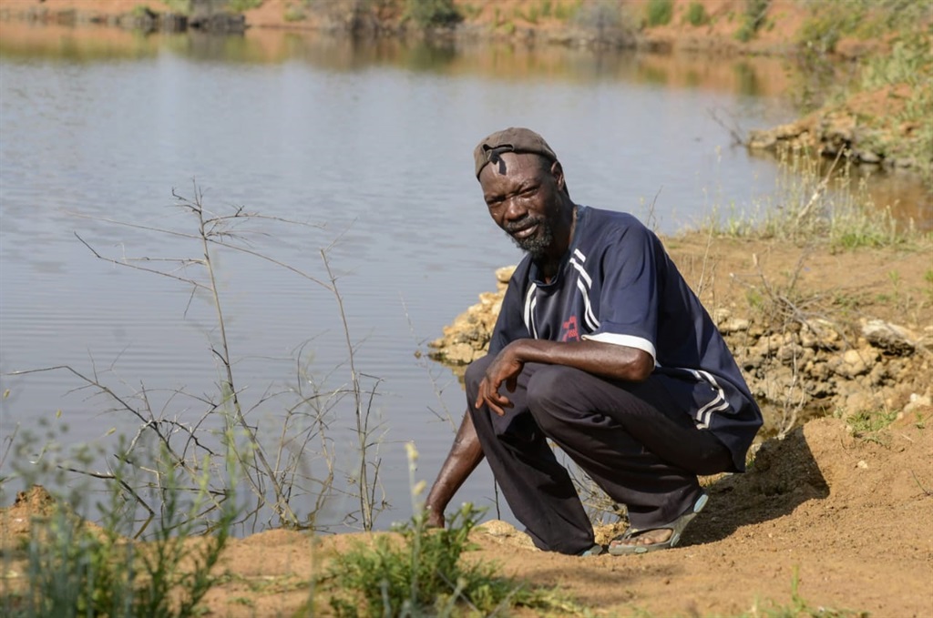 Johannes Kekana (41) near the dam where his girlfriend drowned. Photo by Raymond Morare