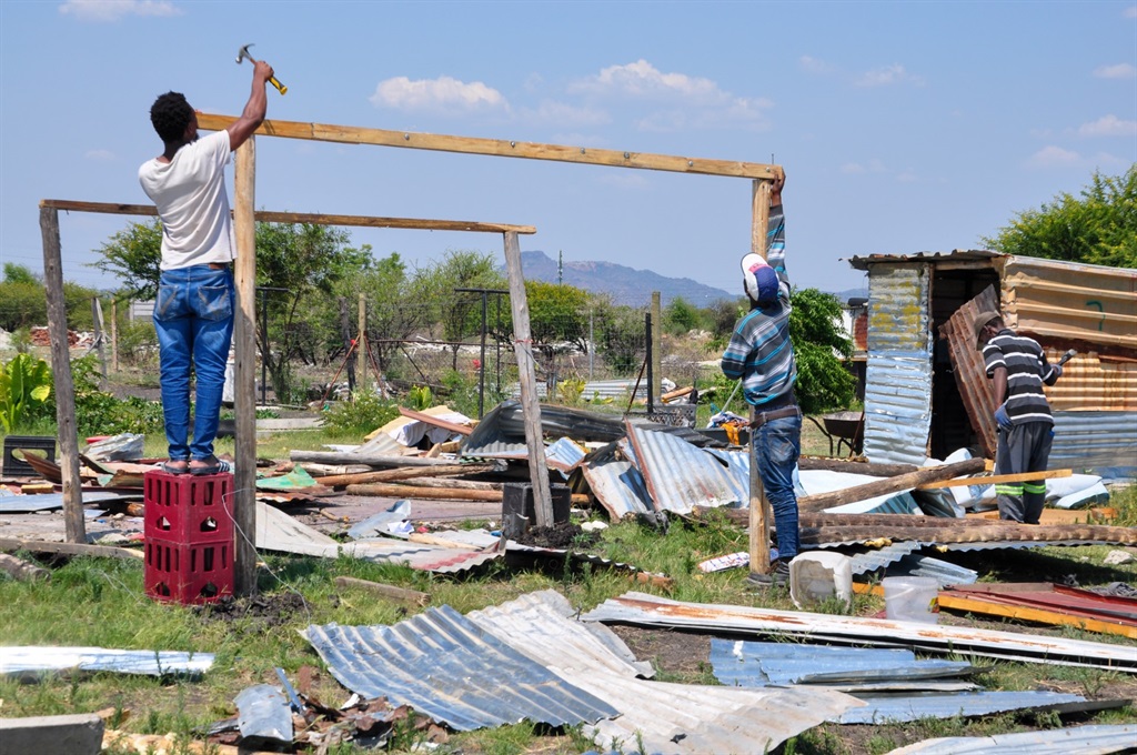 Residents of Tshenolong outside Rustenburg are rebuilding their shacks after they were demolished last week. Photo by Rapula Mancai