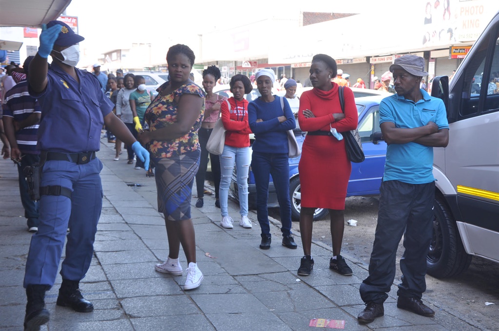 Law enforcement keep an eye to the commuters of Rustenburg  to maintain social distancing at the CBD on Friday. Photos by Rapula Mancai 